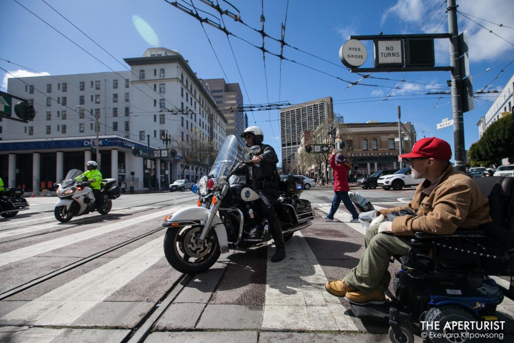 Police officers block Market Street as protesters march from San Francisco City Hall to Embarcadero on Wednesday, March 14, 2018 as part of a nationwide school walkout to protest against gun violence on the one-month anniversary of the Parkland school shooting in Florida that a gunman killed 17 people. (Photo by Ekevara Kitpowsong)