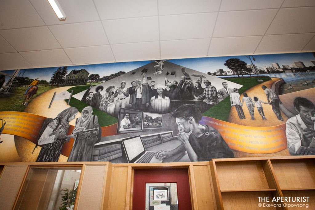 A new mural "Mack Town Rising" created by an Oakland muralist Daniel Galvez, can be seen on the large wall in The McClymonds Library Innovation Technology Center at McClymonds High School in Oakland, Calif. on Wednesday, Jan. 9, 2019. (Photo by Ekevara Kitpowsong/Current SF)