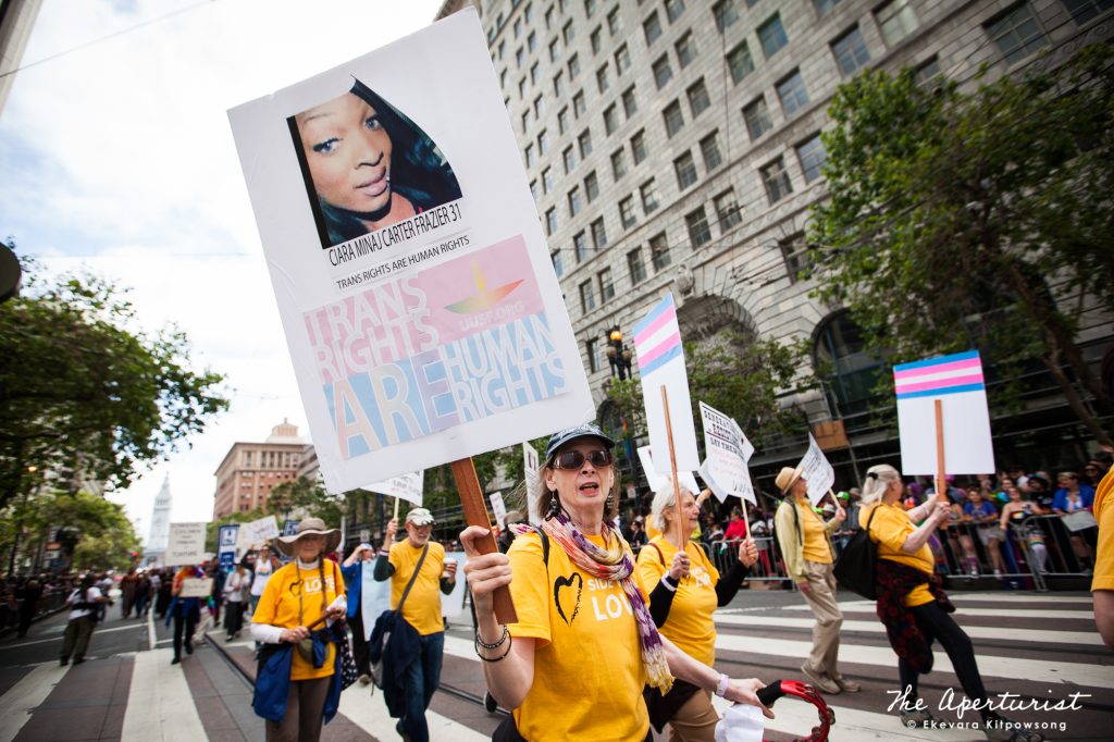 Parade participants hold banners at the San Francisco Pride Parade on Market Street in San Francisco on Sunday, June 30, 2019. (Photo by Ekevara Kitpowsong/Current SF)