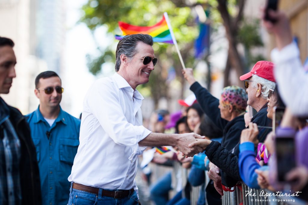 The 40th Governor of California and the former San Francisco mayor Gavin Newsom shakes hands with people in the crowd during the San Francisco Pride Parade on Sunday, June 30, 2019, in San Francisco, Calif. (Photo by Ekevara Kitpowsong/Current SF)